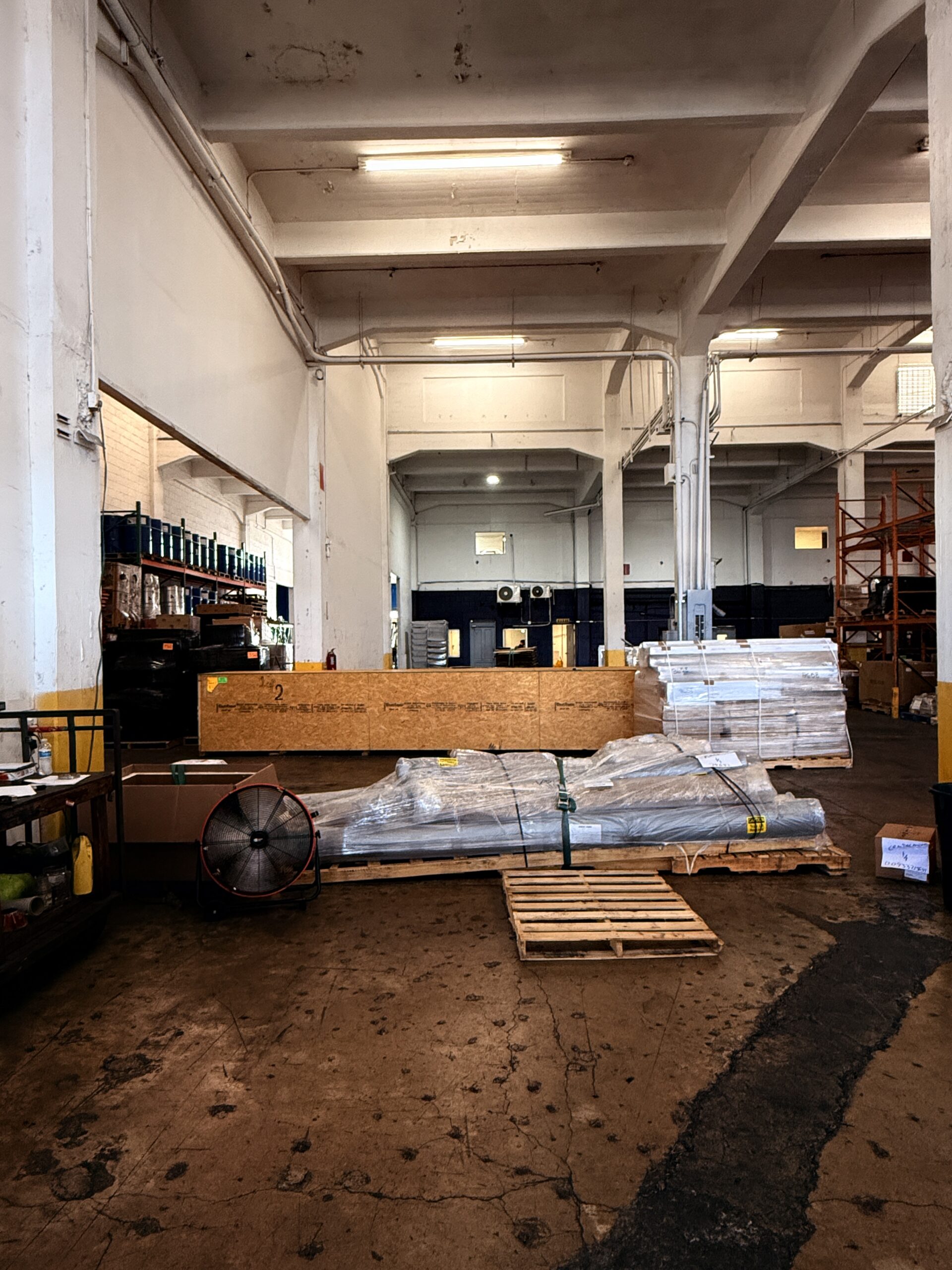 Palletized and shrink-wrapped freight staged for dispatch inside the SJU Logistics Puerto Rico warehouse